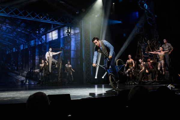 Professional picture of our BMX performer in Spain performing onstage alongside other circus performers | Altus Entertainment